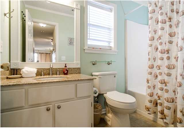 11 Beachside Drive, Unit 1023 Santa Rosa Beach, FL 32459 - Photo 12 of 24 a bathroom with a sink a toilet a mirror and shower