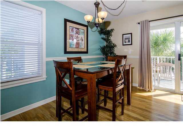 11 Beachside Drive, Unit 1023 Santa Rosa Beach, FL 32459 - Photo 3 of 24 a kitchen with a table and chairs in it
