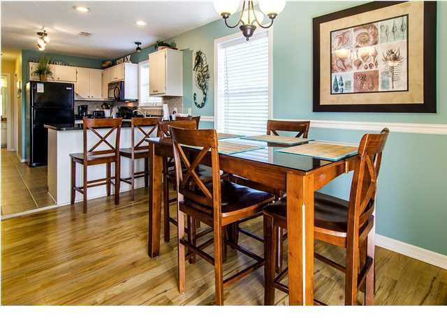 11 Beachside Drive, Unit 1023 Santa Rosa Beach, FL 32459 - Photo 4 of 24 a view of a dining room with furniture and wooden floor