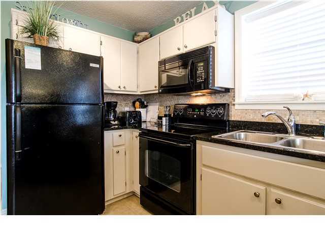 11 Beachside Drive, Unit 1023 Santa Rosa Beach, FL 32459 - Photo 7 of 24 a kitchen with a refrigerator stove and sink