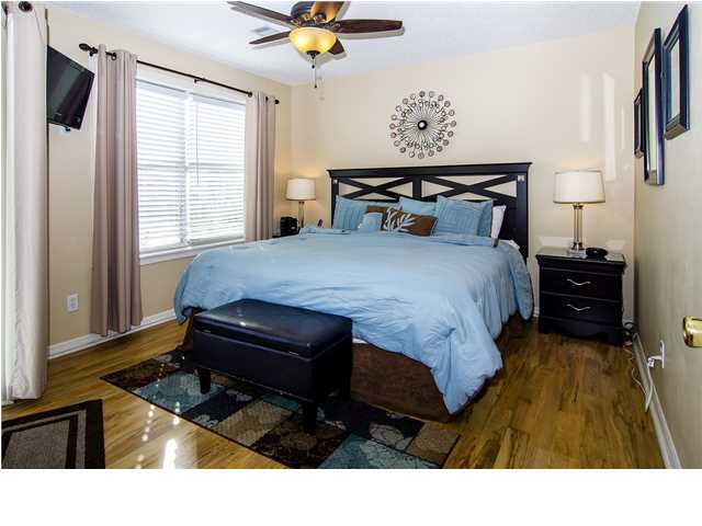 11 Beachside Drive, Unit 1023 Santa Rosa Beach, FL 32459 - Photo 8 of 24 a bedroom with a bed and wooden floor