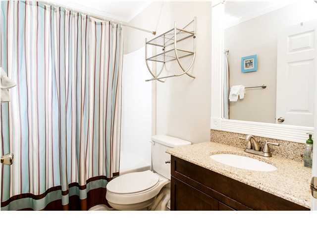 11 Beachside Drive, Unit 1023 Santa Rosa Beach, FL 32459 - Photo 10 of 24 a bathroom with a sink a toilet and mirror