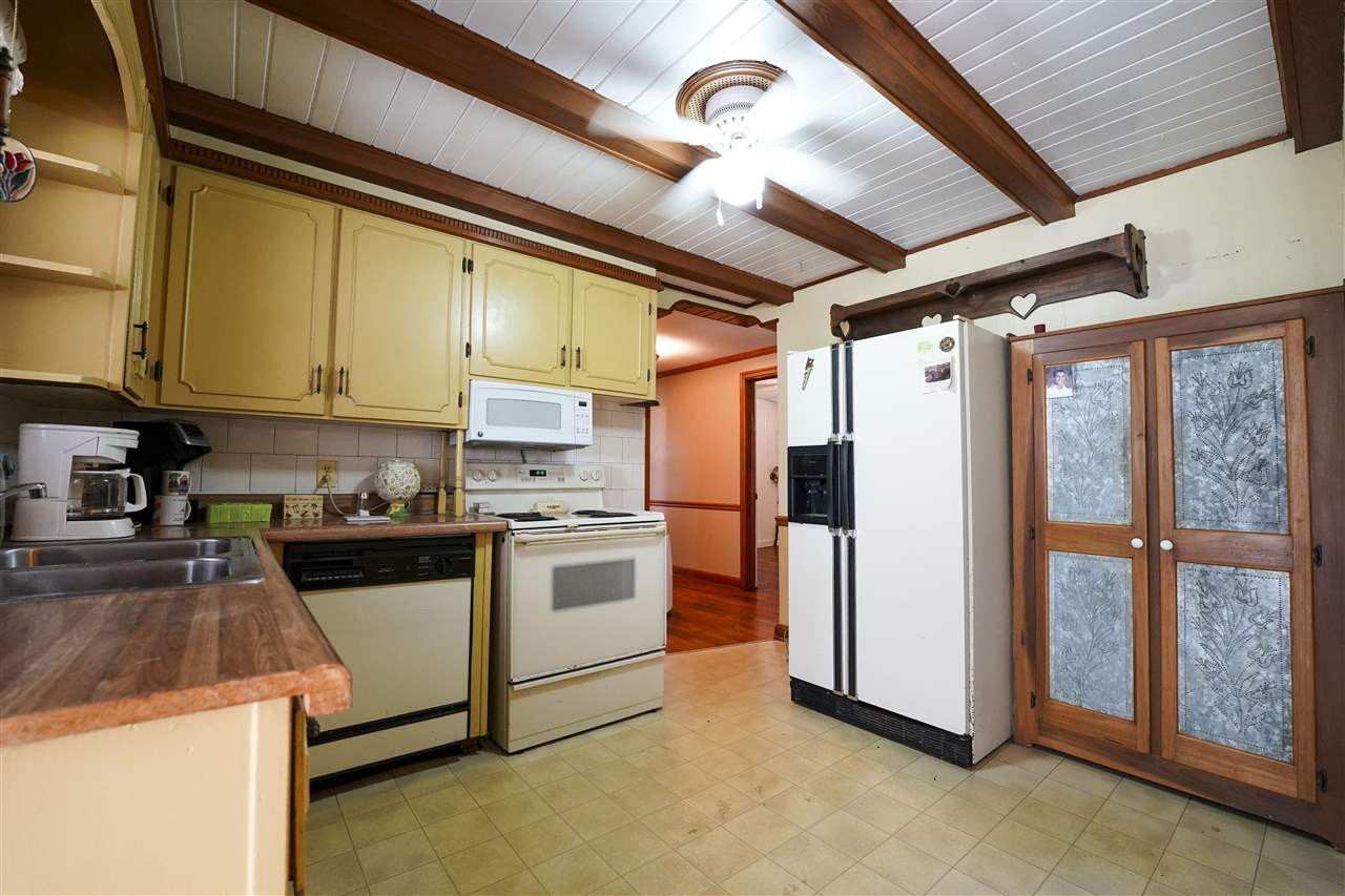 309 Hopper Street Rutherford, TN 38369 - Photo 5 of 14 a kitchen with a stove a refrigerator and cabinets