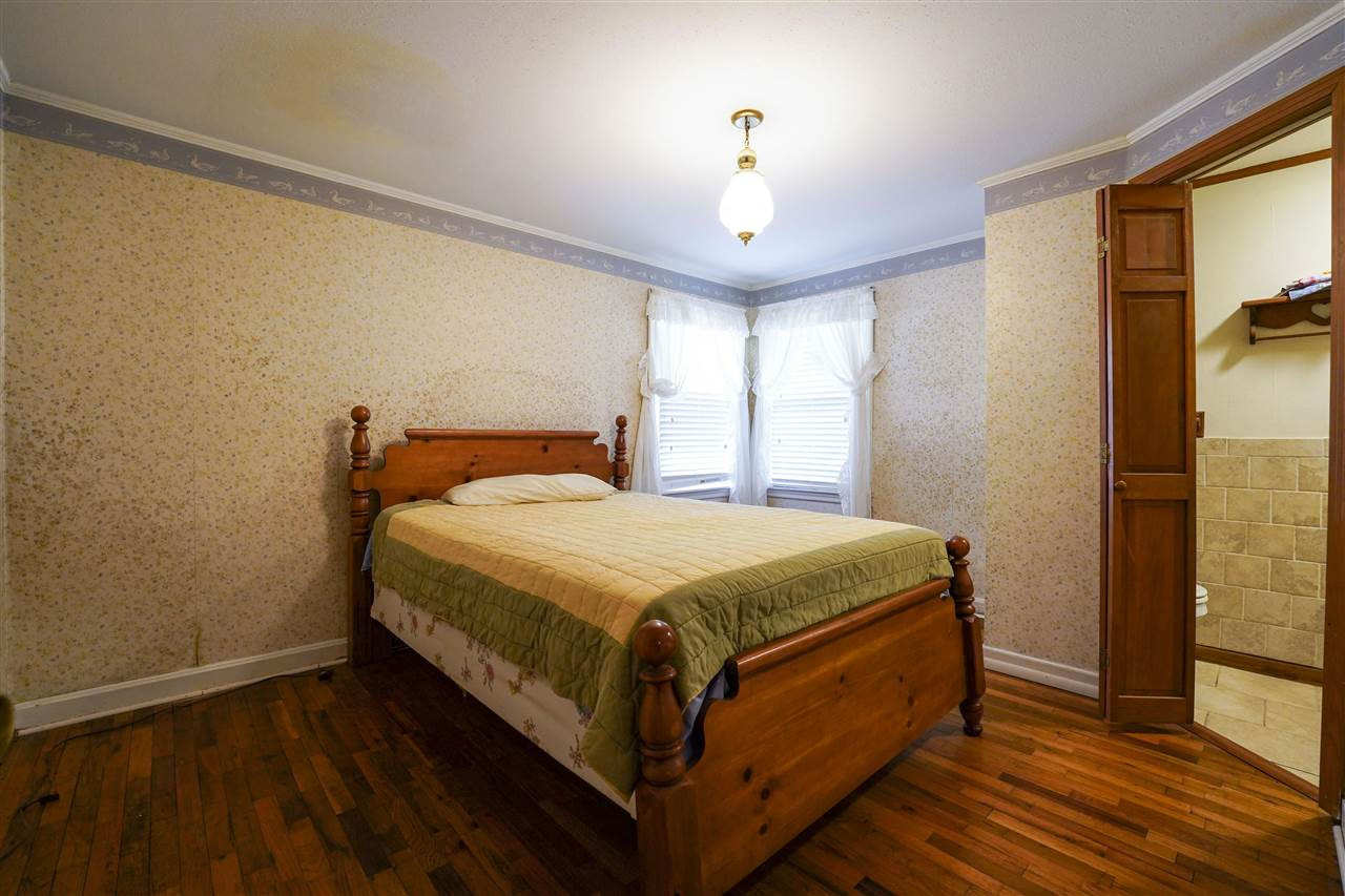 309 Hopper Street Rutherford, TN 38369 - Photo 7 of 14 a bed sitting in a spacious bedroom next to a window
