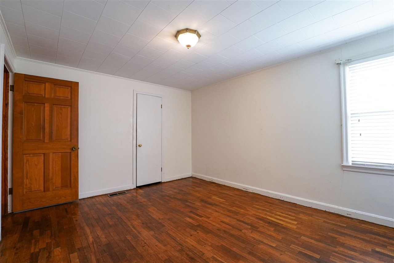309 Hopper Street Rutherford, TN 38369 - Photo 9 of 14 an empty room with wooden floor and windows