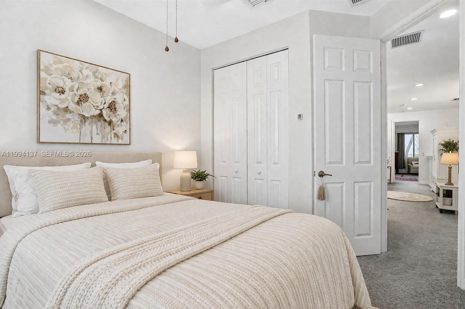 728 Southeast 2nd Street Pompano Beach, FL 33060 - Photo 12 of 27 a bedroom with a bed and a walk in closet