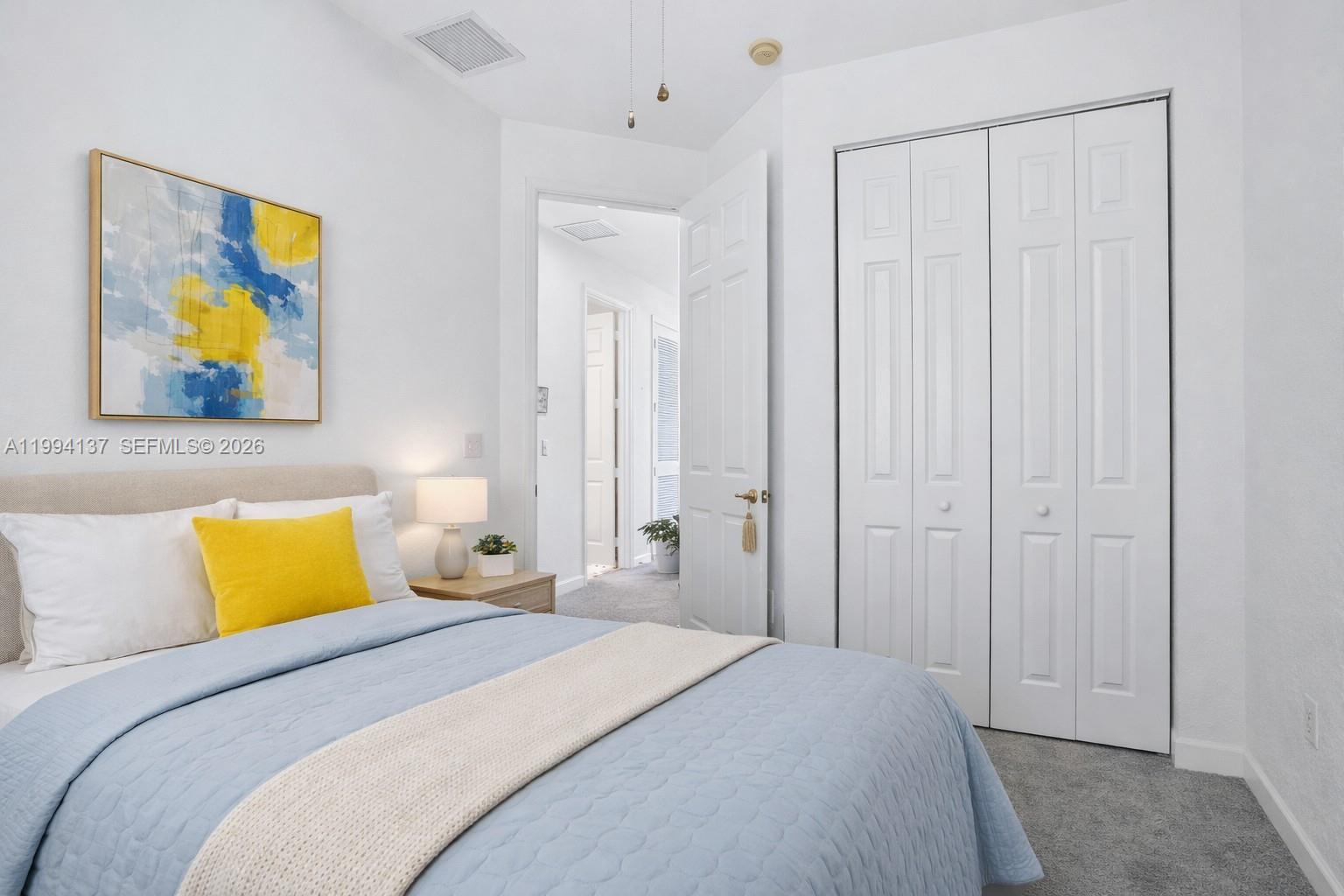 728 Southeast 2nd Street Pompano Beach, FL 33060 - Photo 13 of 27 a bedroom with a bed and painting on the wall