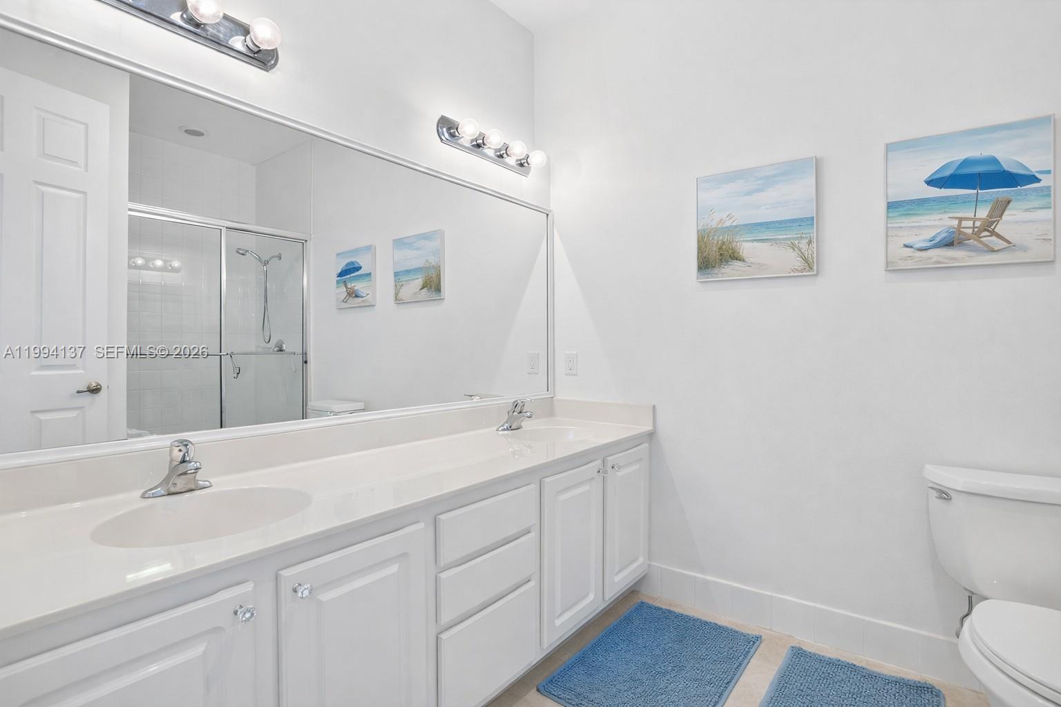 728 Southeast 2nd Street Pompano Beach, FL 33060 - Photo 14 of 27 a bathroom with a sink and a toilet