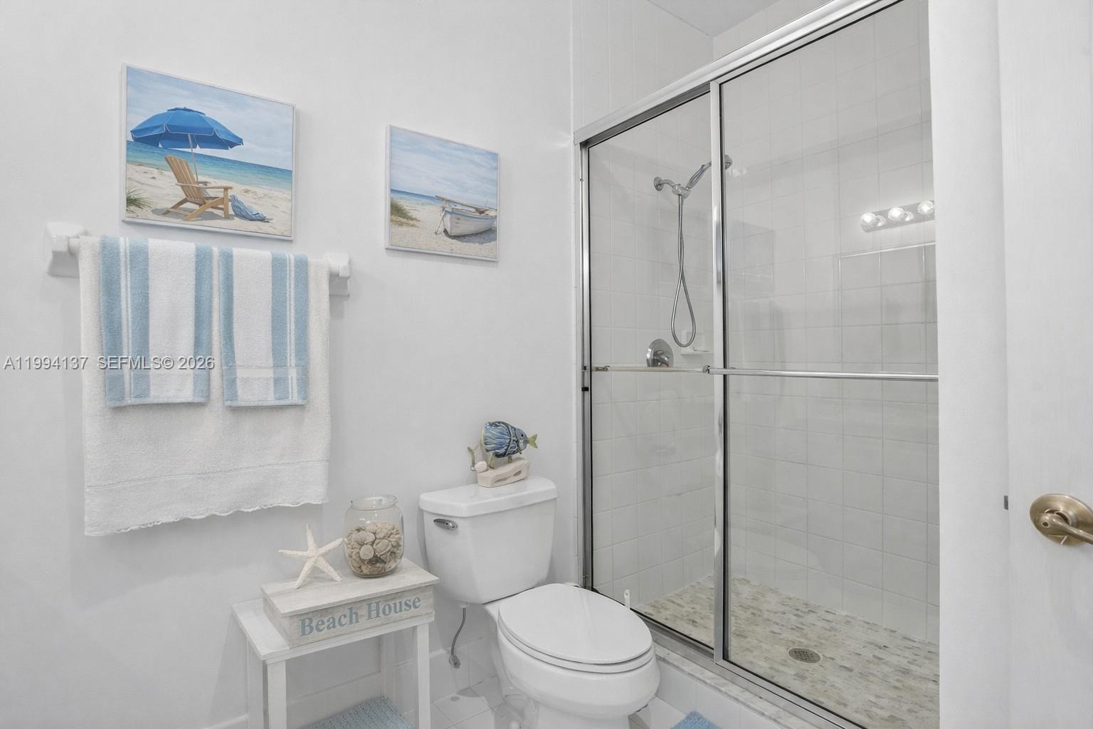 728 Southeast 2nd Street Pompano Beach, FL 33060 - Photo 15 of 27 a bathroom with a toilet a sink and shower