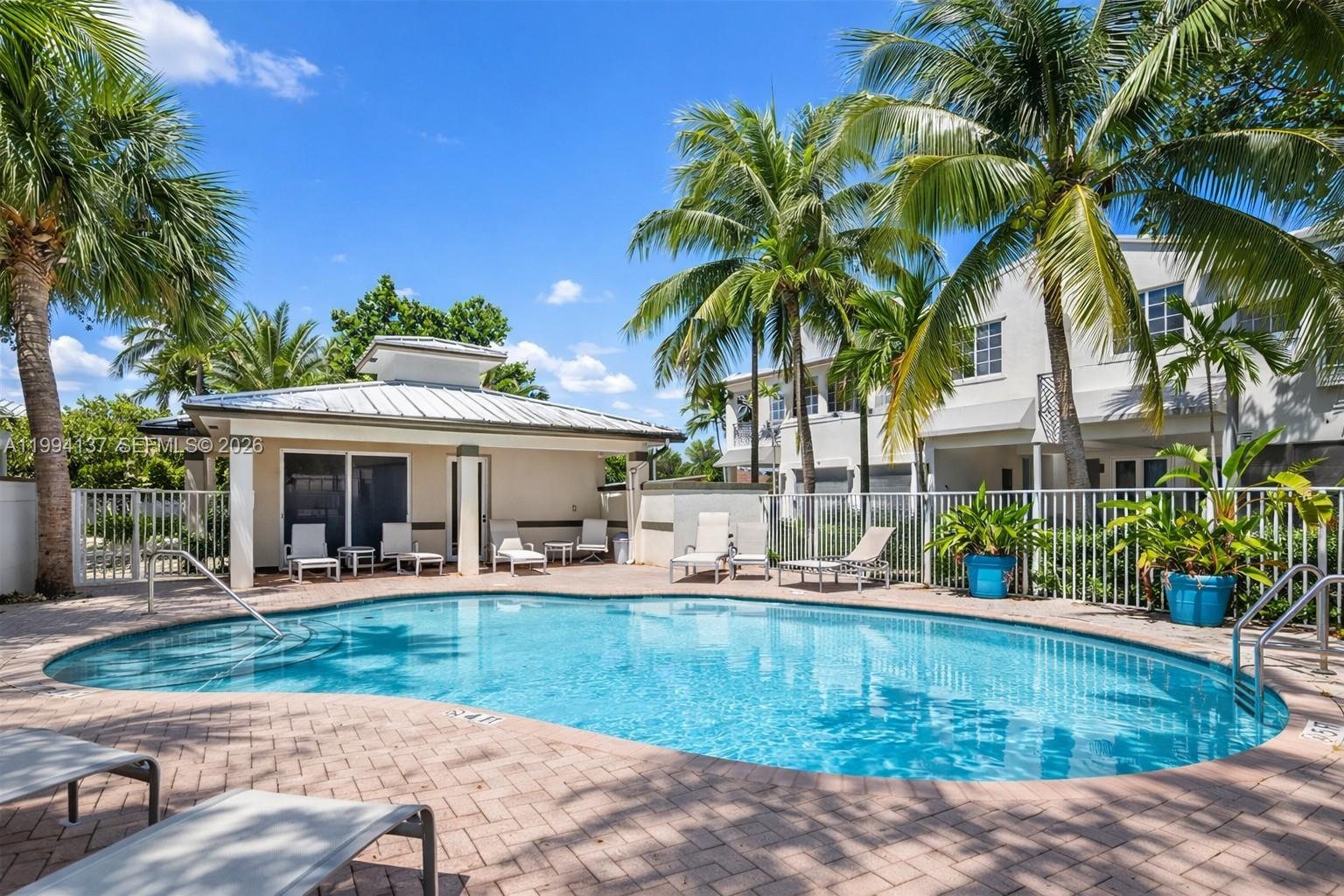728 Southeast 2nd Street Pompano Beach, FL 33060 - Photo 19 of 27 a view of a house with swimming pool and sitting area