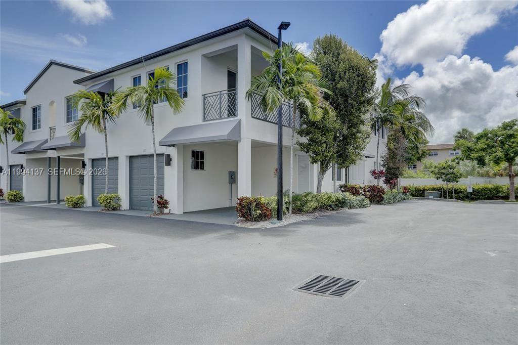 728 Southeast 2nd Street Pompano Beach, FL 33060 - Photo 24 of 27 a front view of house with yard and green space