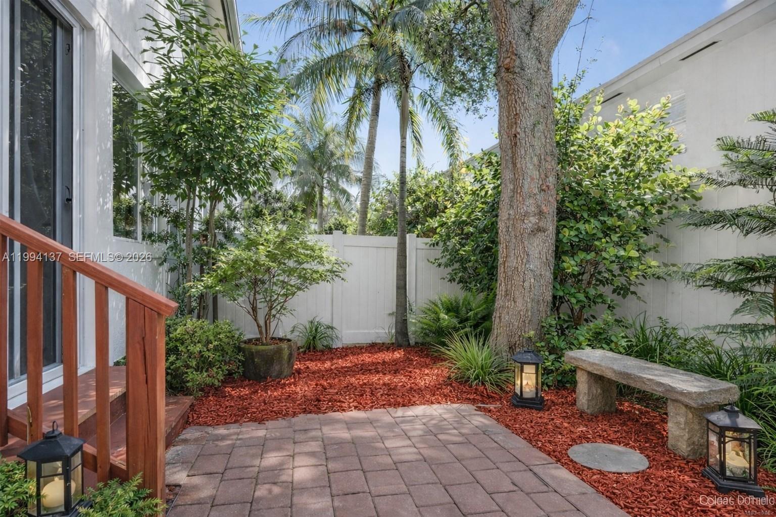 728 Southeast 2nd Street Pompano Beach, FL 33060 - Photo 4 of 27 a view of a backyard with plants and a barbeque