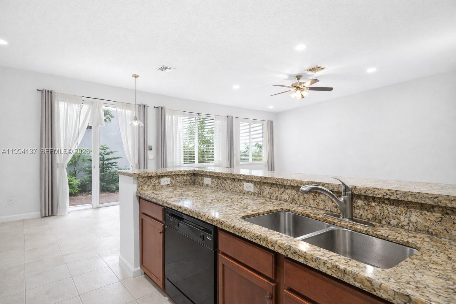 728 Southeast 2nd Street Pompano Beach, FL 33060 - Photo 6 of 27 a kitchen with a sink and large window