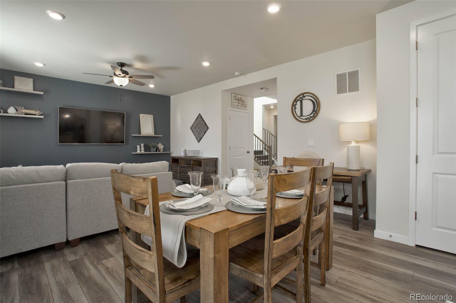 1131 Williams Loop Elizabeth, CO 80107 - Photo 13 of 40 a view of a dining room with furniture and wooden floor