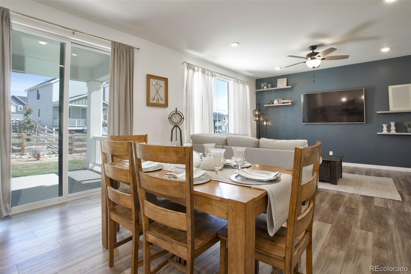 1131 Williams Loop Elizabeth, CO 80107 - Photo 14 of 40 a view of a dining room with furniture and wooden floor
