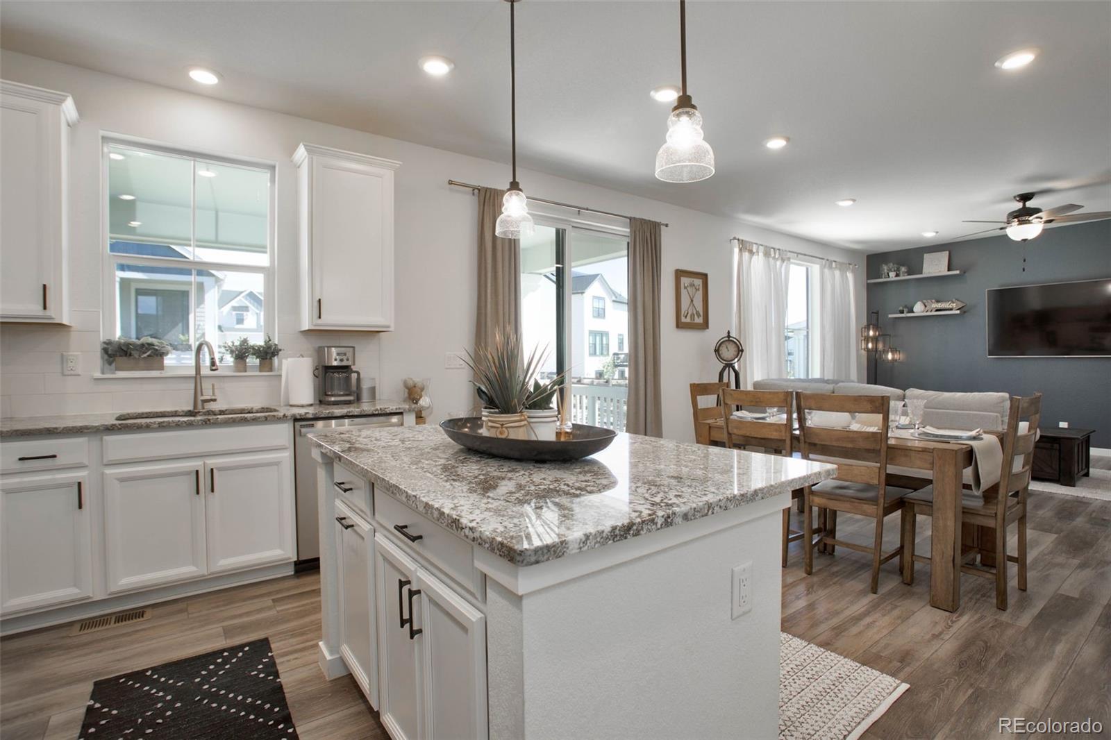 1131 Williams Loop Elizabeth, CO 80107 - Photo 18 of 40 a kitchen with sink stove and cabinets