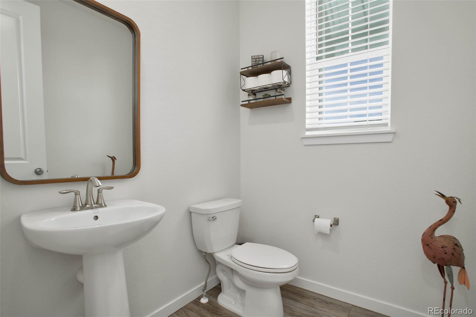 1131 Williams Loop Elizabeth, CO 80107 - Photo 21 of 40 a bathroom with a sink toilet and a mirror