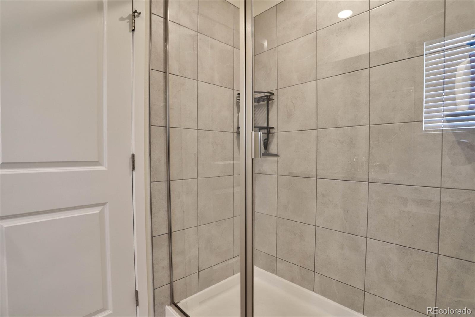 1131 Williams Loop Elizabeth, CO 80107 - Photo 26 of 40 a bathroom with a shower
