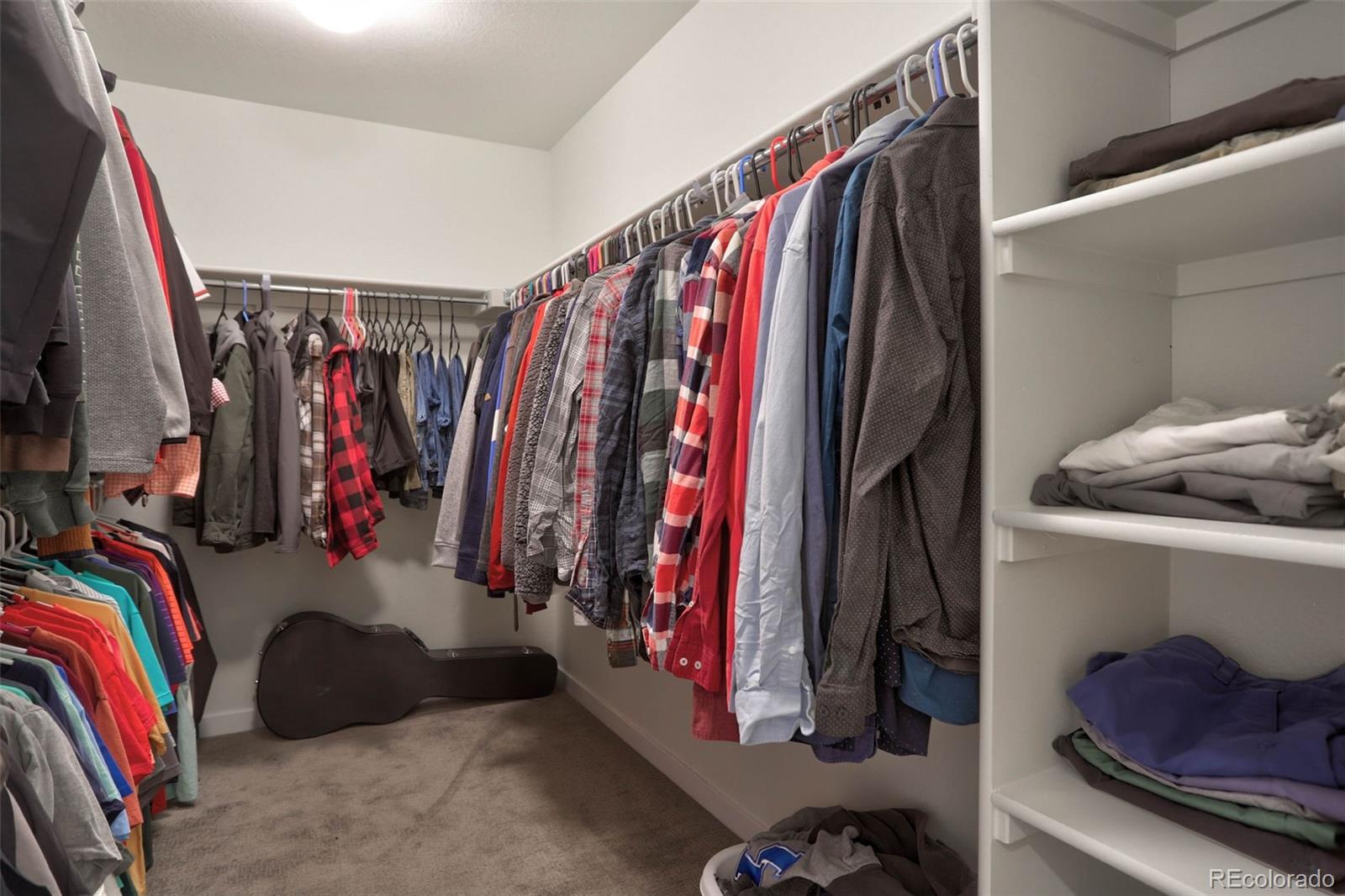 1131 Williams Loop Elizabeth, CO 80107 - Photo 27 of 40 a view of walk in closet with clothes