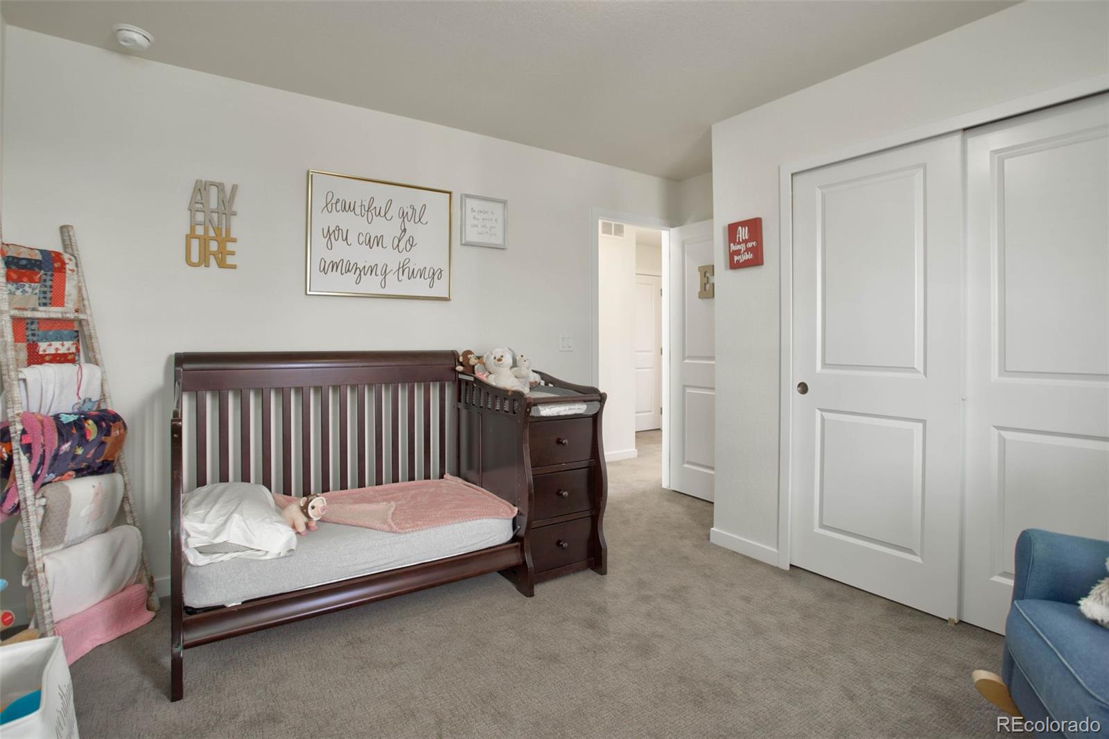 1131 Williams Loop Elizabeth, CO 80107 - Photo 29 of 40 a bedroom with a bed and chair
