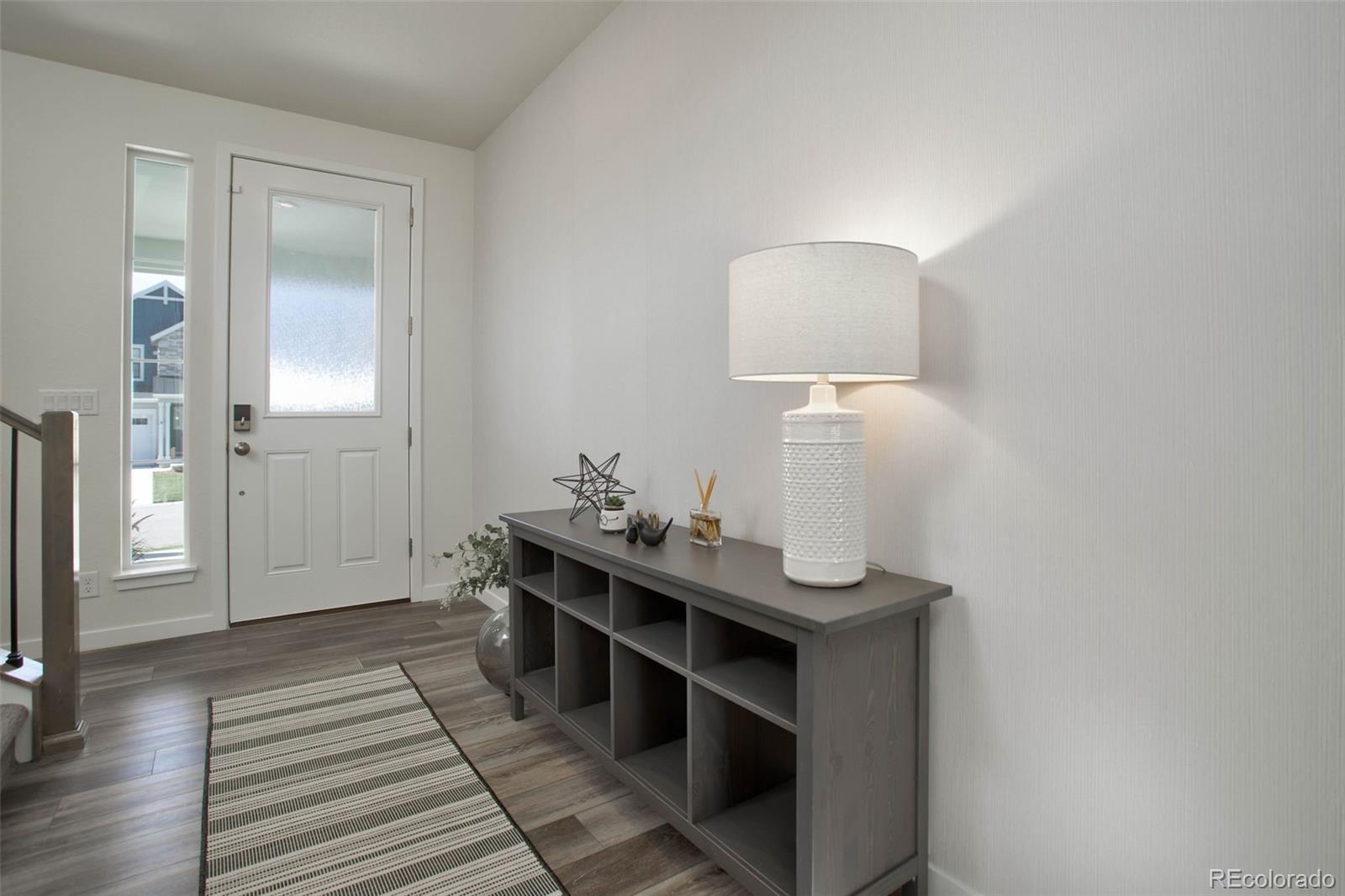 1131 Williams Loop Elizabeth, CO 80107 - Photo 6 of 40 a room with a table and a mirror