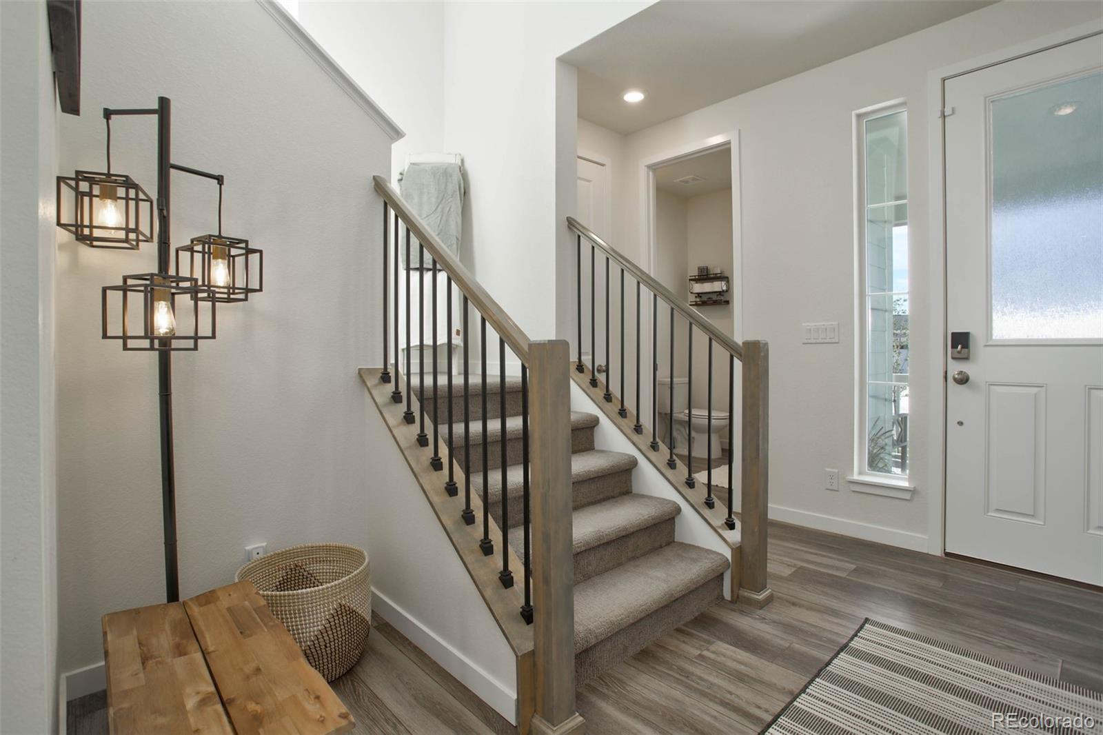 1131 Williams Loop Elizabeth, CO 80107 - Photo 7 of 40 a view of entryway and hall with wooden floor
