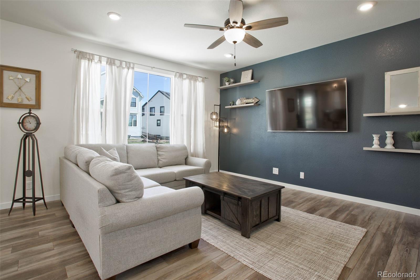 1131 Williams Loop Elizabeth, CO 80107 - Photo 9 of 40 a living room with furniture and a flat screen tv