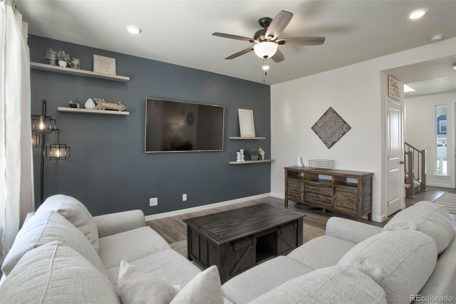 1131 Williams Loop Elizabeth, CO 80107 - Photo 10 of 40 a living room with furniture and a flat screen tv
