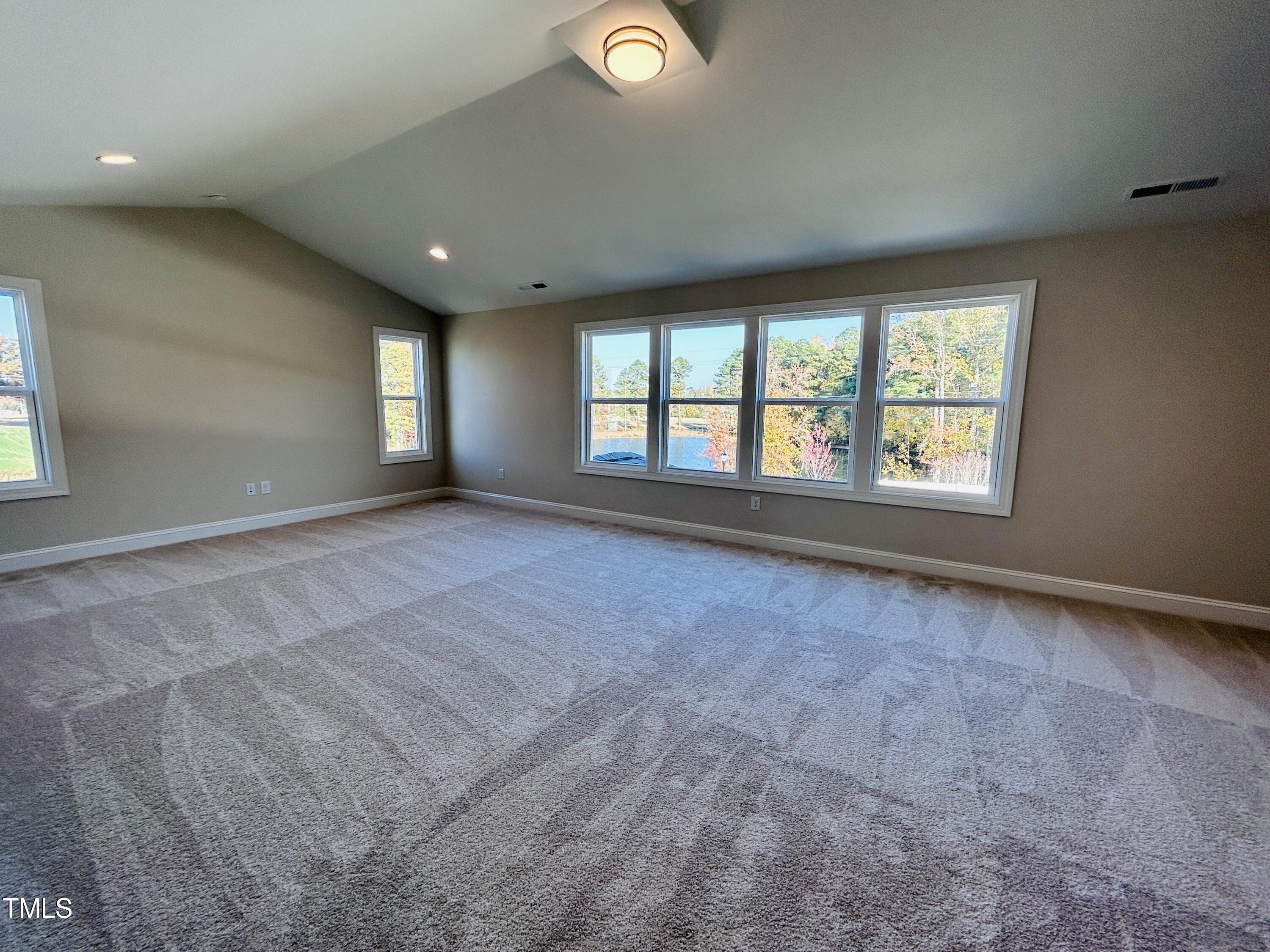 1220 Marsh Hawk Way Wake Forest, NC 27587 - Photo 18 of 23 a view of an empty room with a window