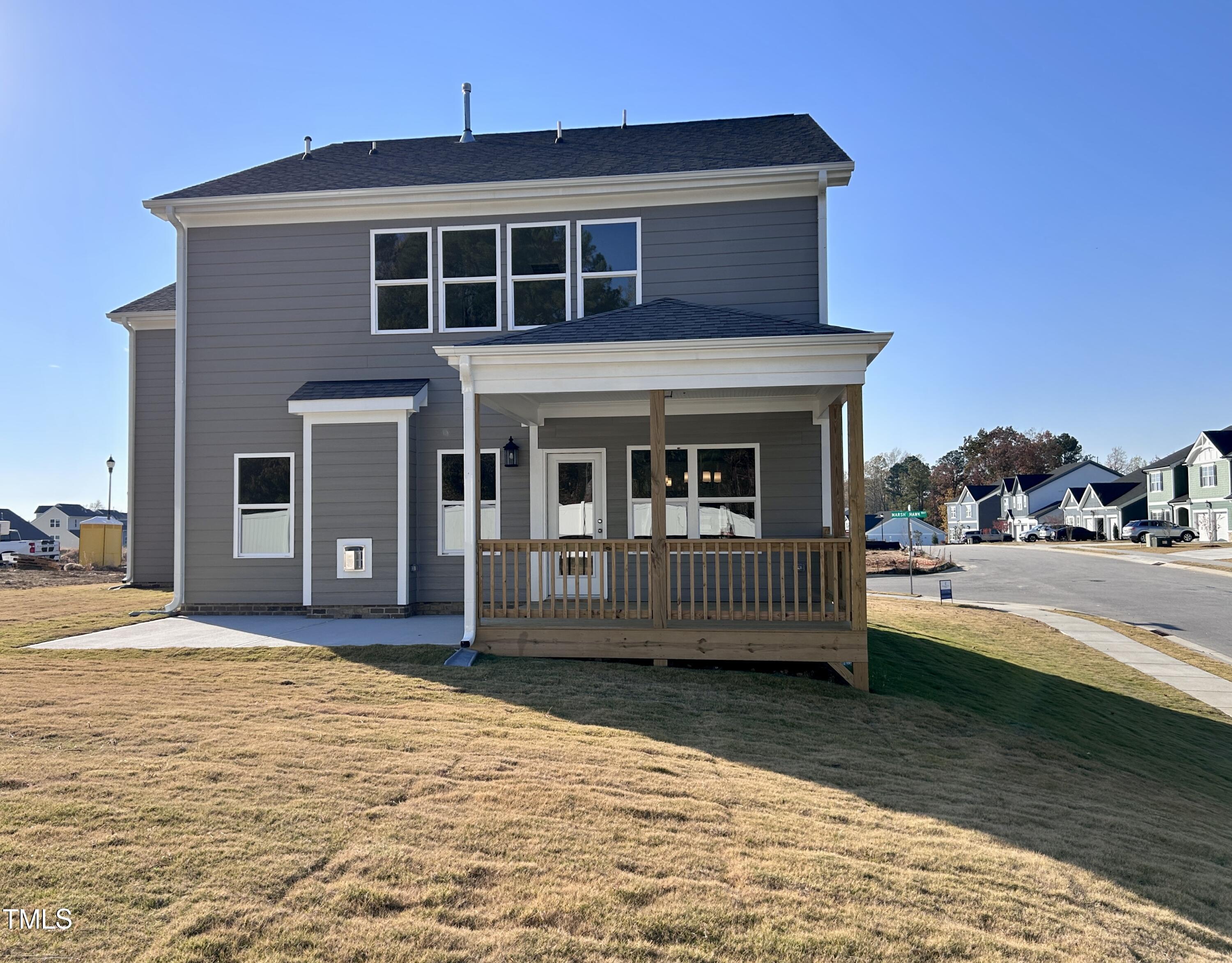 1220 Marsh Hawk Way Wake Forest, NC 27587 - Photo 19 of 23 a front view of a house with a yard