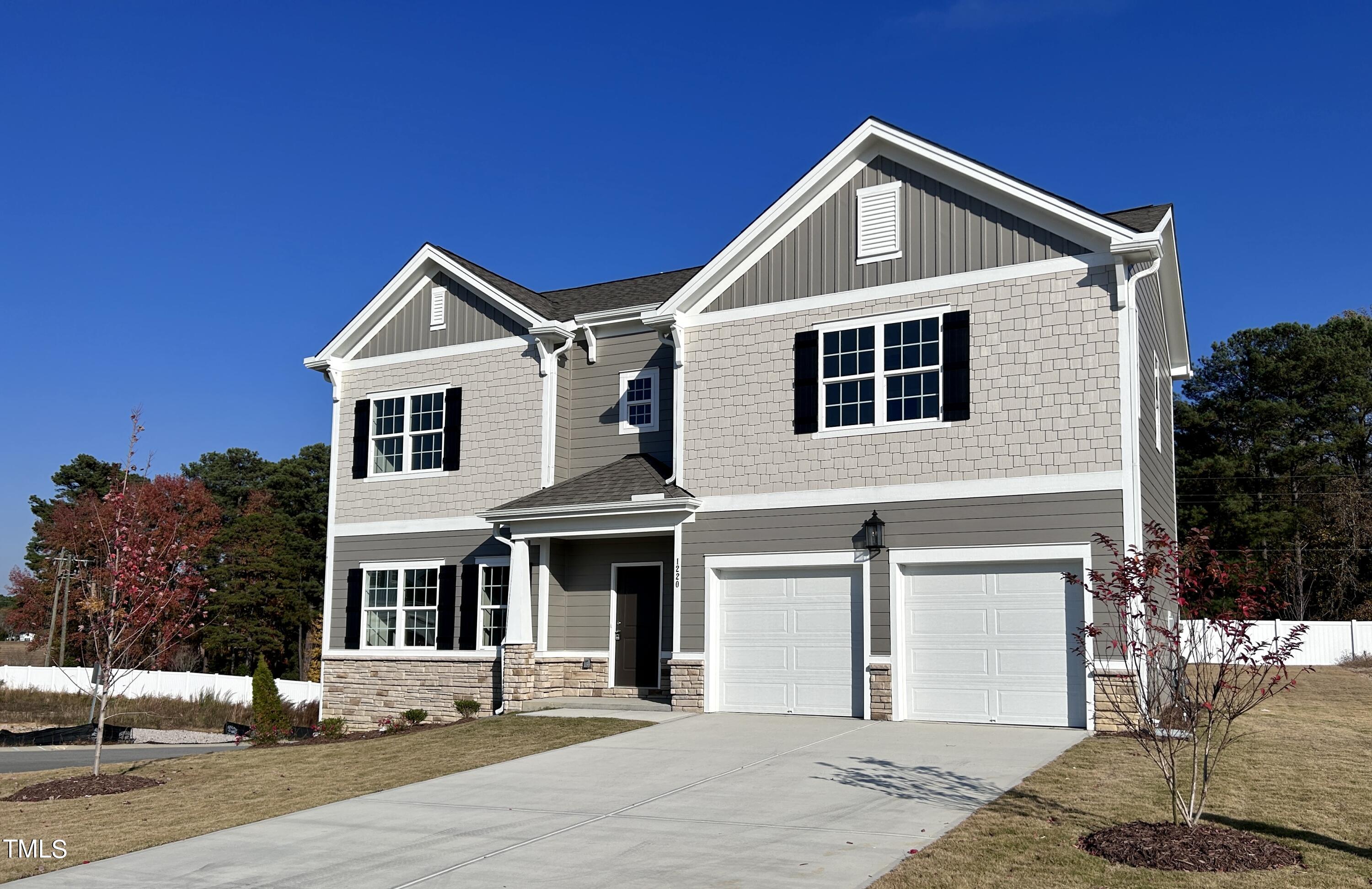 1220 Marsh Hawk Way Wake Forest, NC 27587 - Photo 2 of 23 a front view of a house with a yard