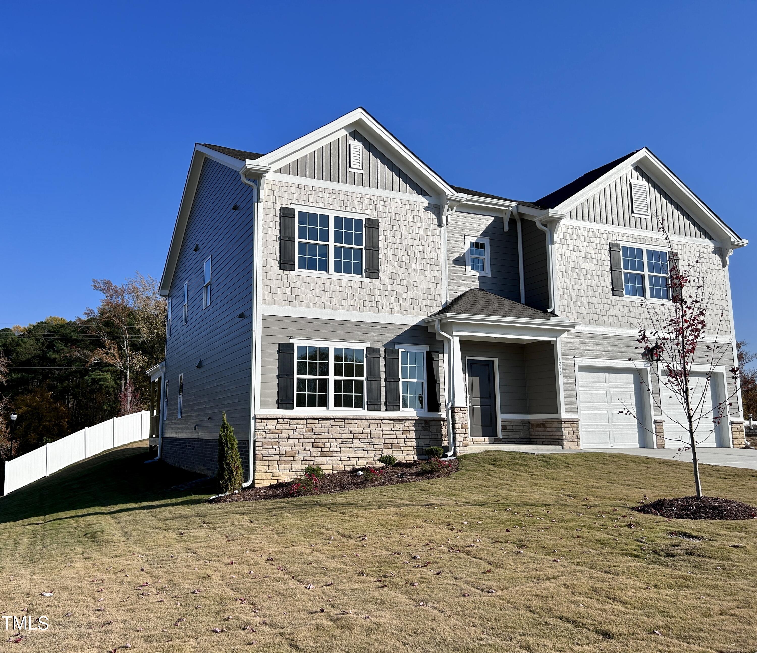 1220 Marsh Hawk Way Wake Forest, NC 27587 - Photo 3 of 23 a front view of a house with a yard