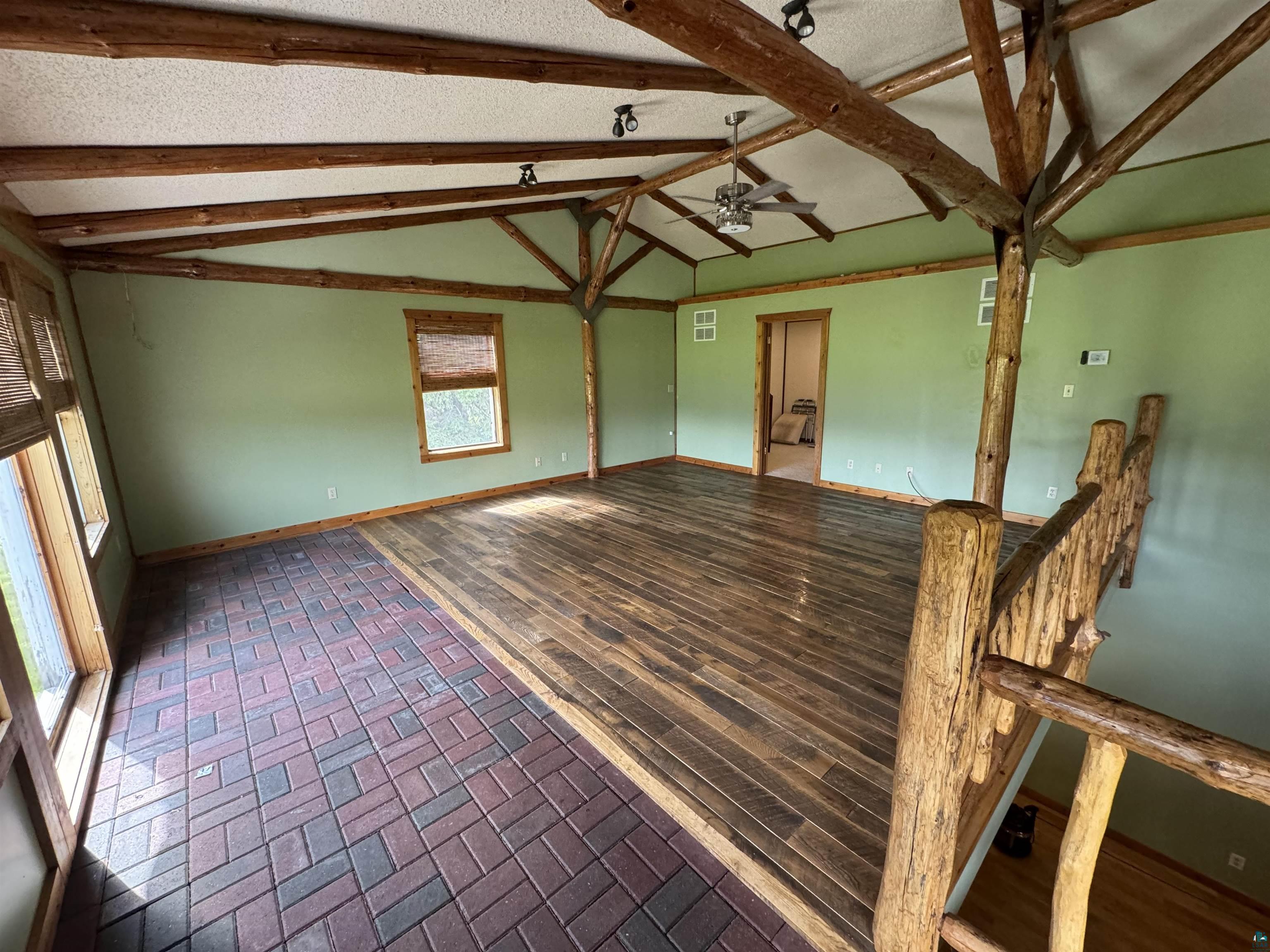 7264 NE Road Wright, MN 55798 - Photo 5 of 17 Livingroom featuring a healthy amount of sunlight and hardwood / wood-style flooring