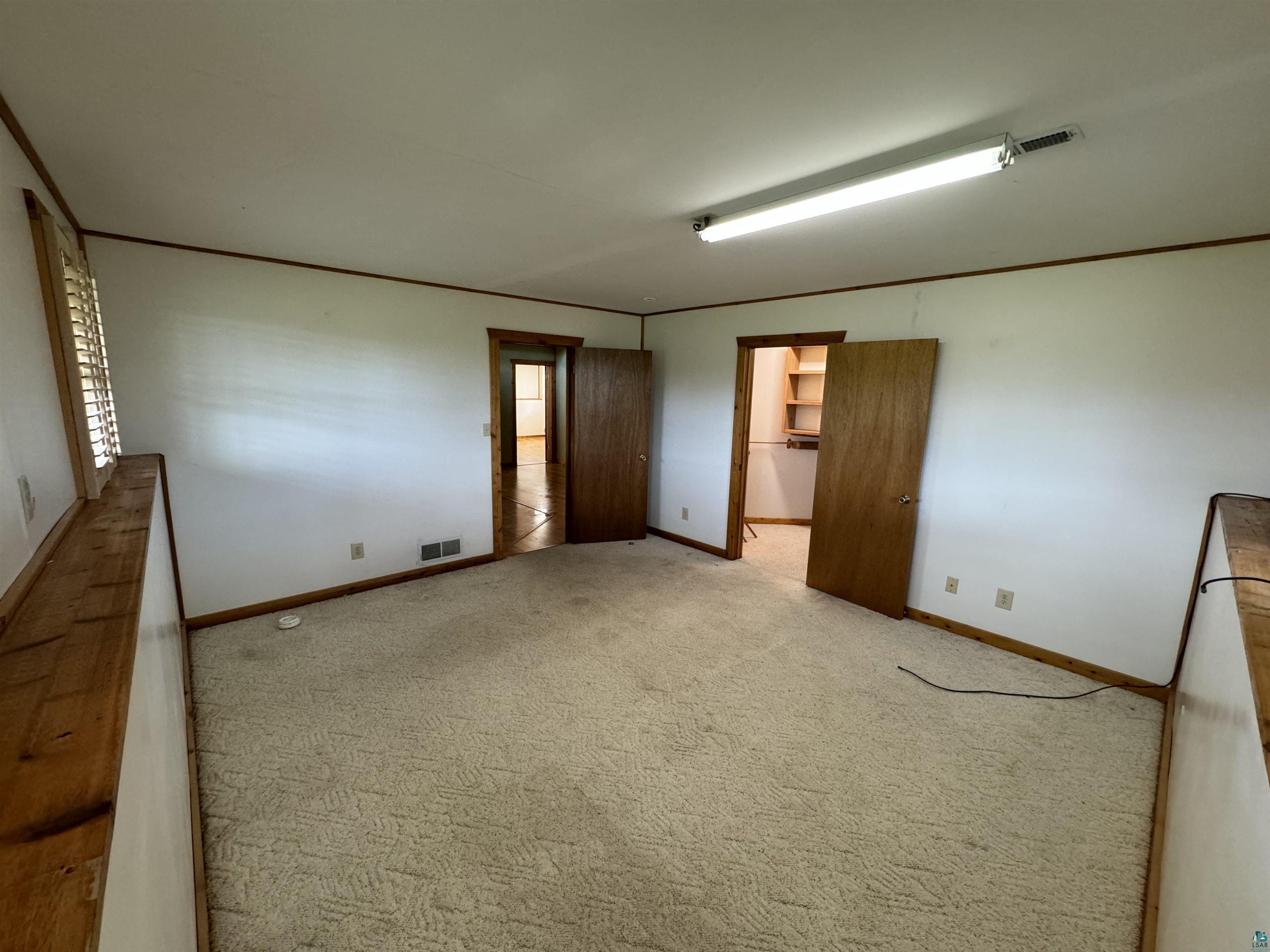 7264 NE Road Wright, MN 55798 - Photo 10 of 17 Spare room with carpet flooring
