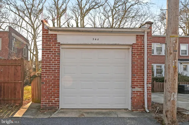 a view of a brick building next to a yard