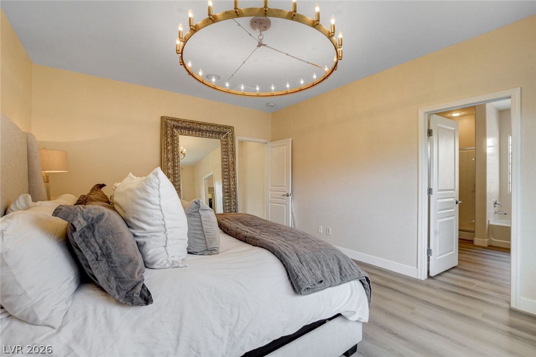 2649 Rue Marquette Avenue Henderson, NV 89044 - Photo 43 of 55 This primary bedroom showcases ample space and durable flooring, with convenient access to a private bath.