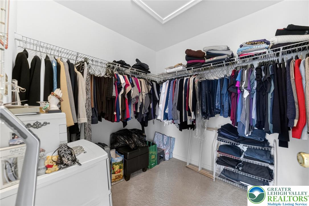 5440 Spring Ridge Drive West Macungie, PA 18062 - Photo 20 of 40 Customizable wire shelving and ample hanging space create an organized walk-in closet.