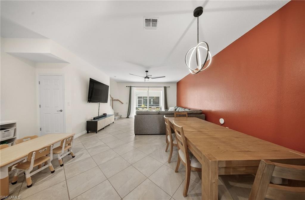2930 Citrus Street Naples, FL 34120 - Photo 10 of 35 a living room with furniture and a flat screen tv