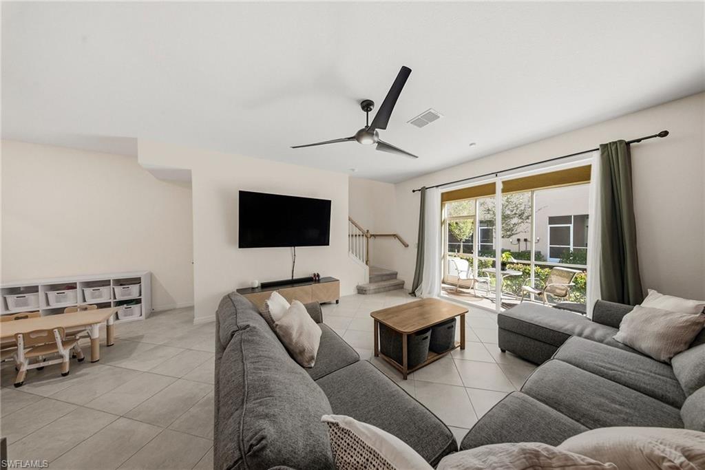 2930 Citrus Street Naples, FL 34120 - Photo 11 of 35 a living room with furniture and a flat screen tv