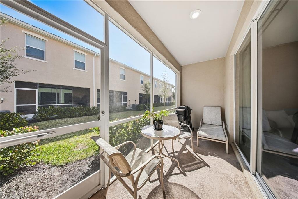 2930 Citrus Street Naples, FL 34120 - Photo 12 of 35 a view of an chairs and tables in the balcony