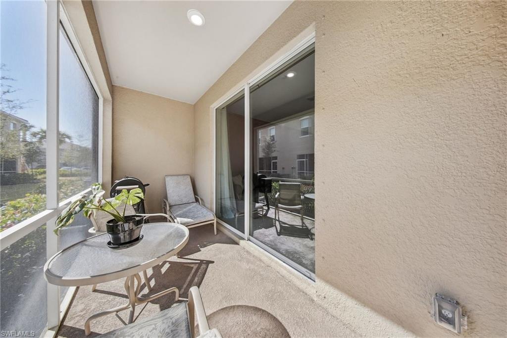 2930 Citrus Street Naples, FL 34120 - Photo 13 of 35 a dining room with furniture and a potted plant