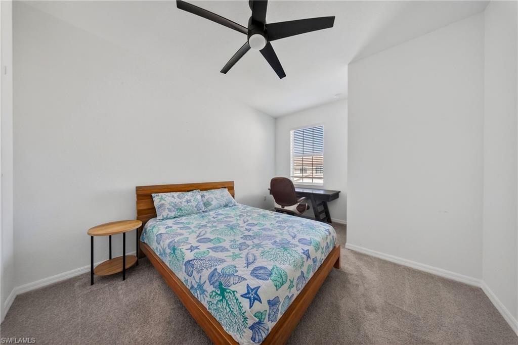 2930 Citrus Street Naples, FL 34120 - Photo 14 of 35 a bedroom with a bed and a window