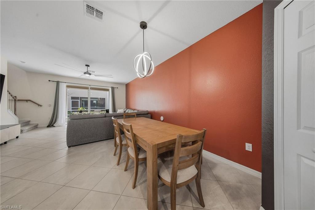 2930 Citrus Street Naples, FL 34120 - Photo 2 of 35 a view of a dining room with furniture and a chandelier