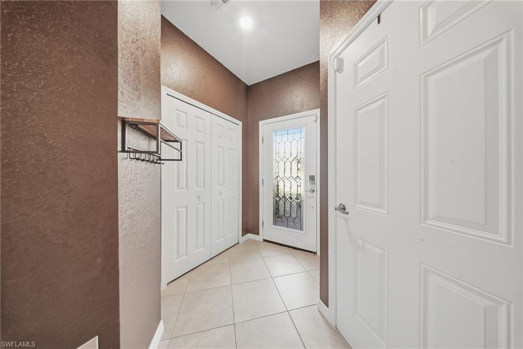 2930 Citrus Street Naples, FL 34120 - Photo 6 of 35 a view of a hallway with wooden floor