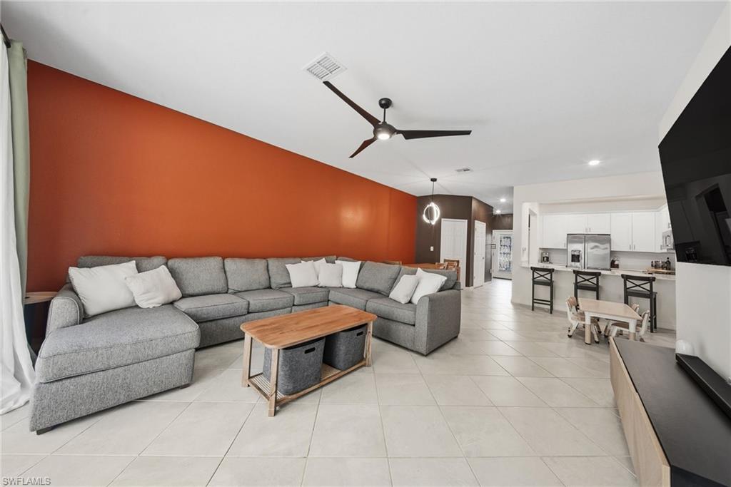 2930 Citrus Street Naples, FL 34120 - Photo 8 of 35 a living room with lots of furniture and view of kitchen