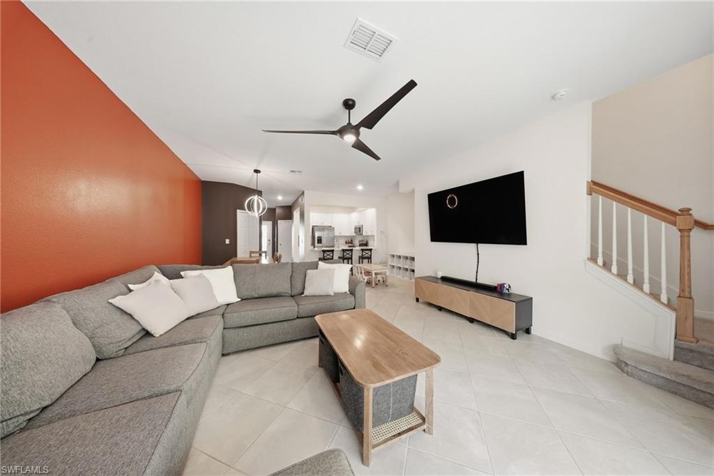 2930 Citrus Street Naples, FL 34120 - Photo 9 of 35 a living room with furniture and a flat screen tv