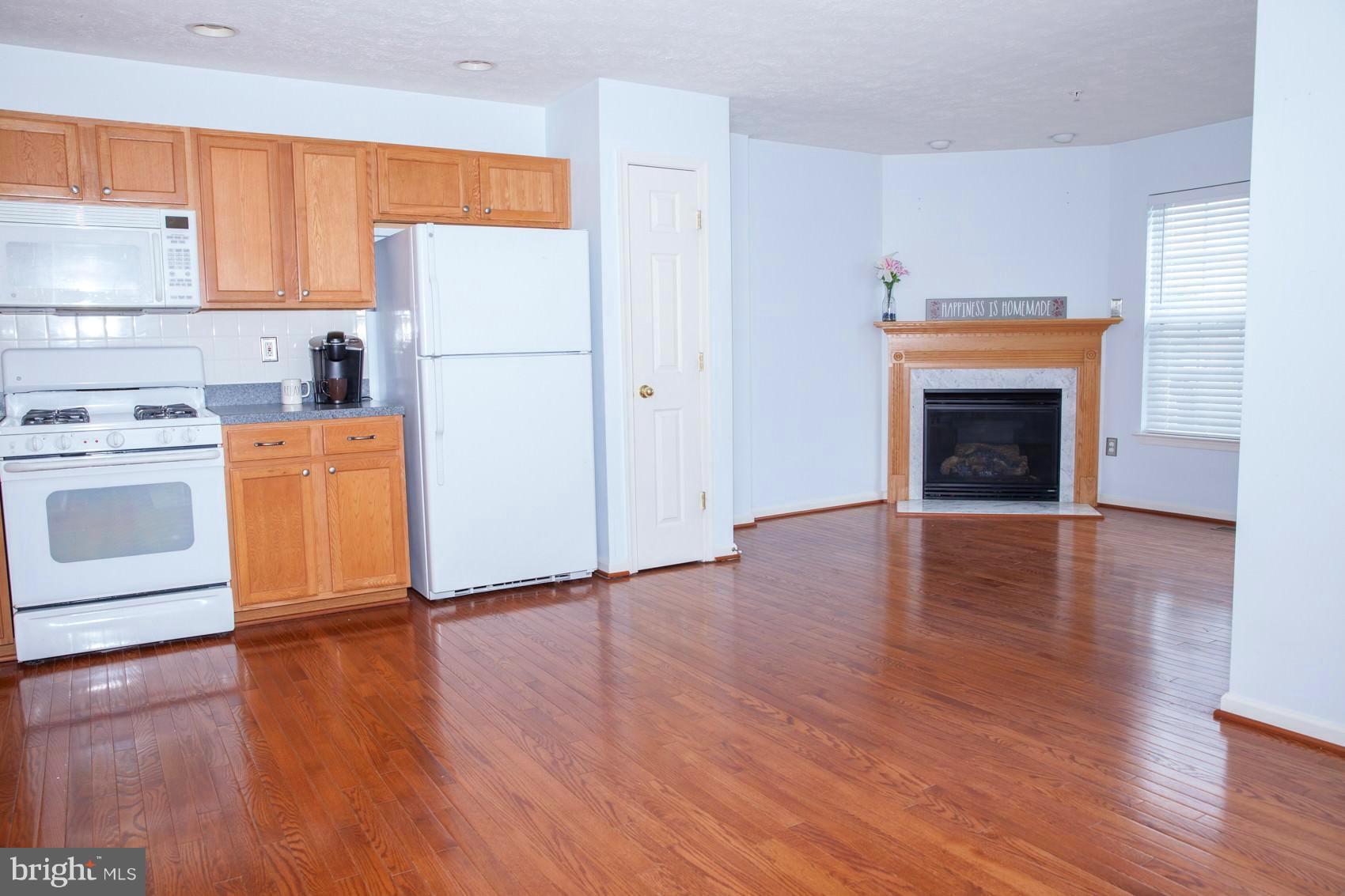 9834 Decatur Road Baltimore, MD 21220 - Photo 10 of 29 Kitchen with fireplace and flex space!