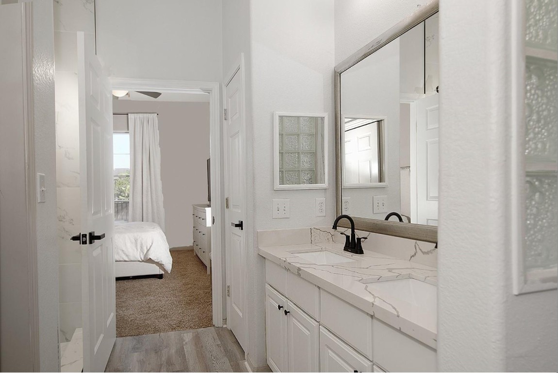 1441 East Street, Unit 212 Houston, TX 77007 - Photo 5 of 6 a bathroom with a sink and a mirror