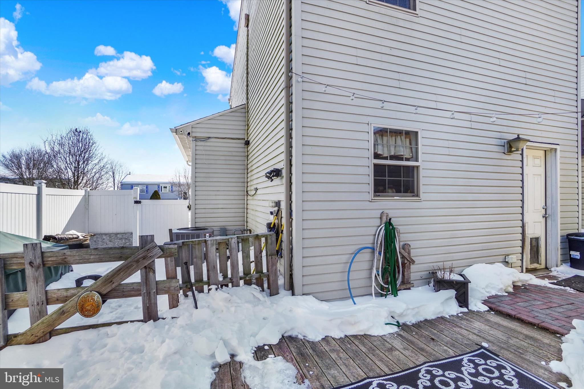 3030 Solar Drive Dover, PA 17315 - Photo 17 of 22 a view of a patio with dining table and chairs with wooden floor