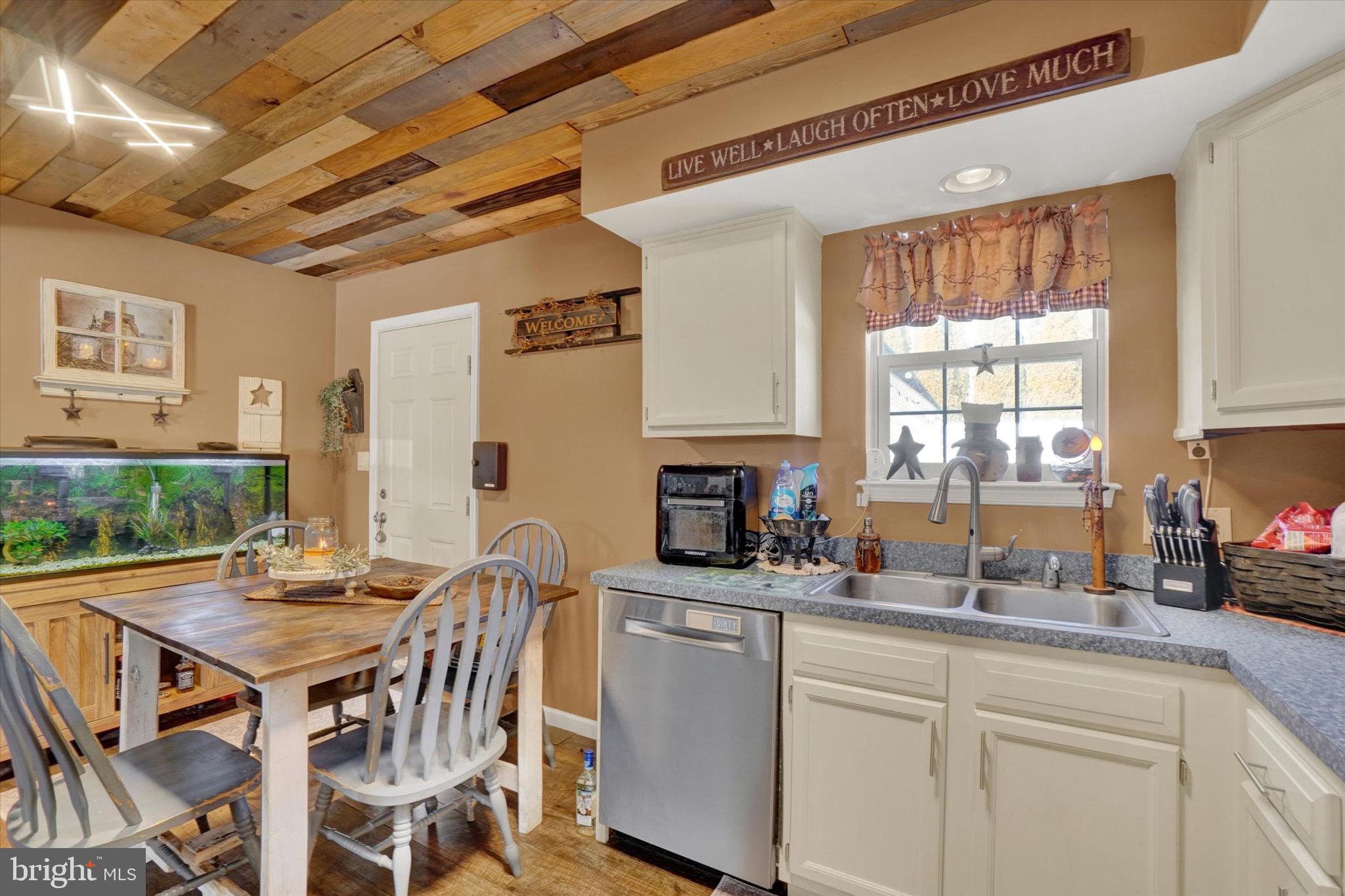 3030 Solar Drive Dover, PA 17315 - Photo 6 of 22 a kitchen with a table chairs stove and cabinets